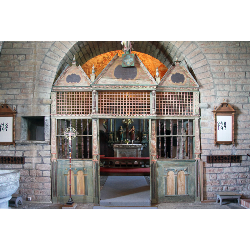 with the baptismal font partially visible in the bottom left corner of the image