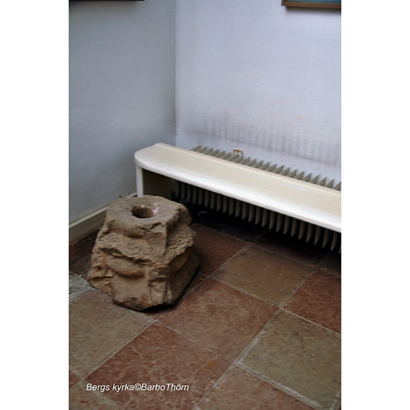 the medieval base fragment as displayed in the porch [vapenhuset] of the modern church
