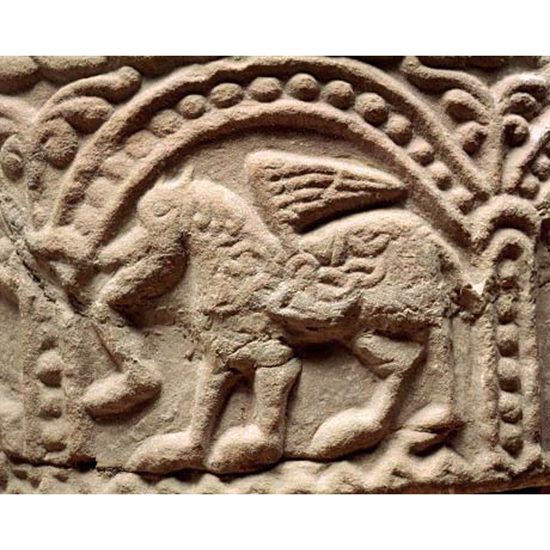 passant to the left -- like the other animals on this font this one, too, has interlace decoration appearing to develop from its mane -- notice the repaired damage on this side