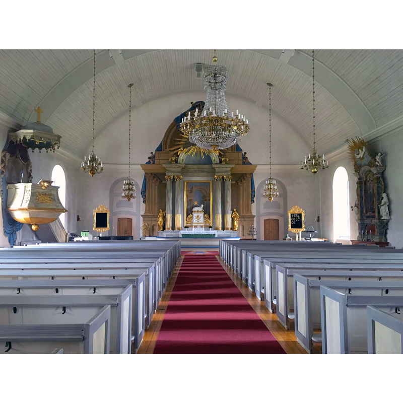 inside the 1797 church -- the 18thC font and its cover are partially visible at the far [east] end, right [south] side, by the psalm poster on that side