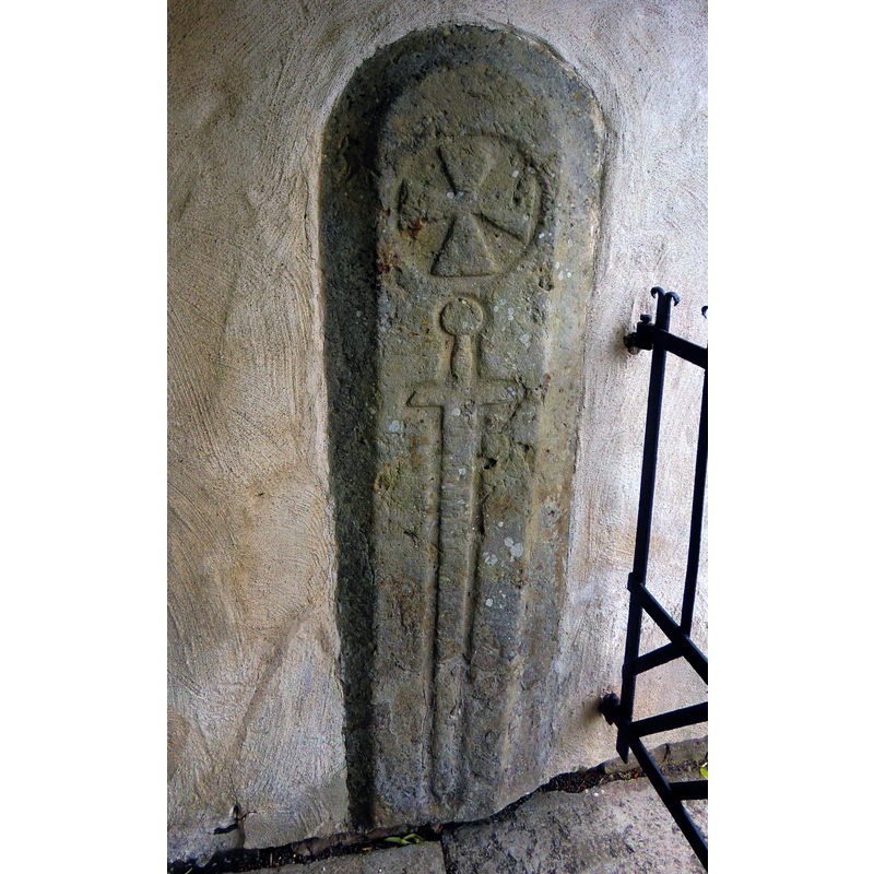 Source caption: "Stavkorshäll inmurad i stigluckan på Friggeråkers kyrka, Falköping. Motivet har stora likheter med vapenbilden för den andliga "Svärdsriddarorden", en riddarorden som var verksam i Baltikum 1204-1237." [NB; the symbols on the stone resemble indeed the arms of the autonomous brand of the Teutonic Order; they are described in the Britannica as "Order of the Brothers of the Sword, Latin Fratres Militiae Christi, German Schwertbrüderorden, byname Knights Of The Sword, Livonian Order, or Livonian Knights, organization of crusading knights that began the successful conquest and Christianization of Livonia (most of modern Latvia and Estonia) between 1202 and 1237" [www.britannica.com/topic/Order-of-the-Brothers-of-the-Sword] [accessed 2 June 2020]]