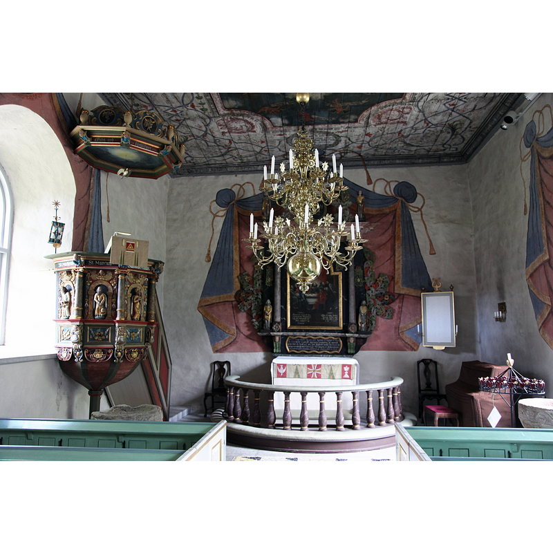 the two medieval fonts are partially visible here: on the left, by the pulpit, the very damaged upper rim of the older font is discernible; the top of the Paradise font is partially visible on the right