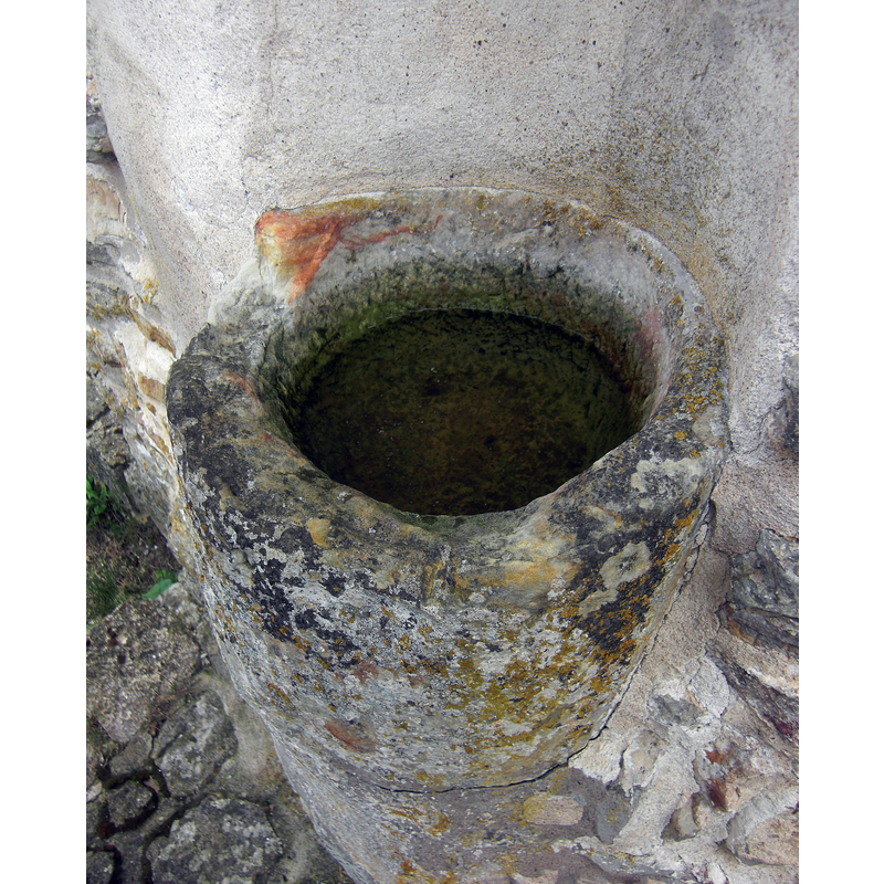located among the present ruins of the medieval nunnery -- Source caption: "Vigvattenskål i Gudhems klosterruin (Raä-nr Gudhem 72:1) i Gudhems socken i Gudhems härad i Västergötland"