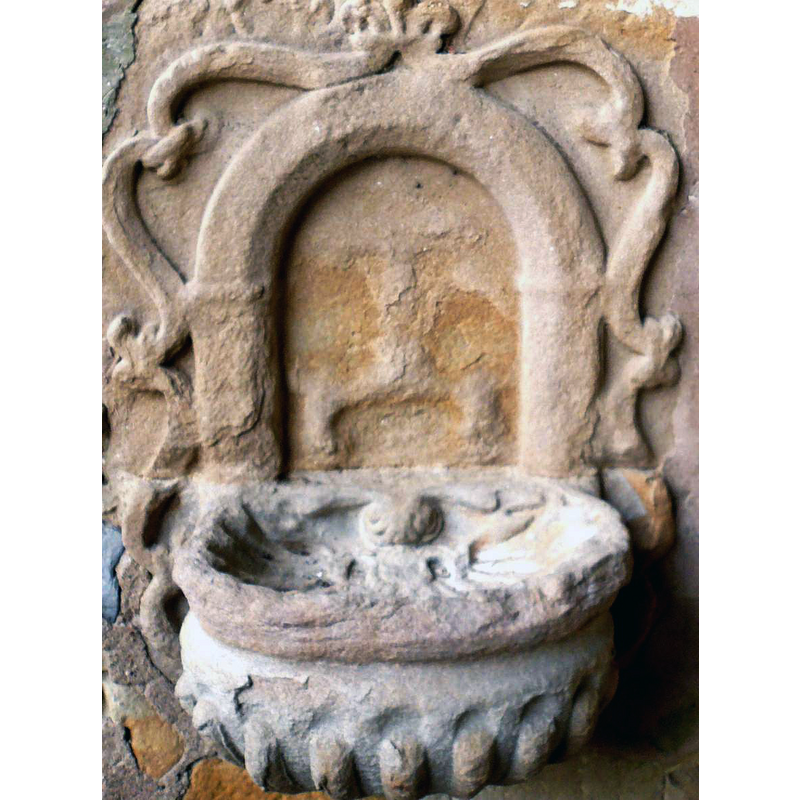 one of several in this church; this one is mounted in the exterior, by the entranceway