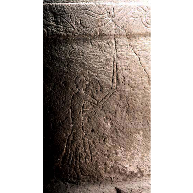 showing both the incised figure and the vine above