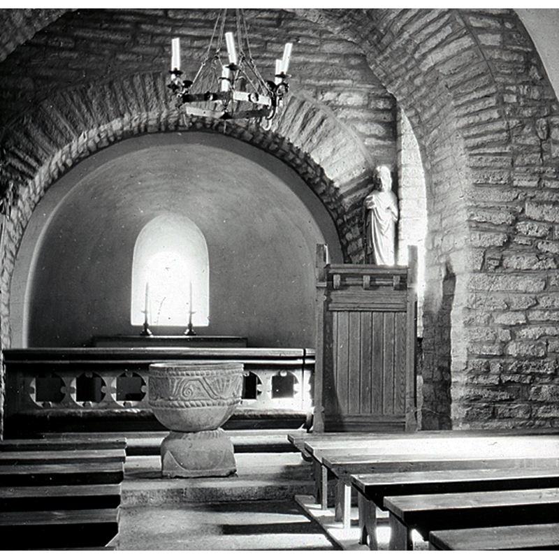 the old font located at the east end of the centre aisle