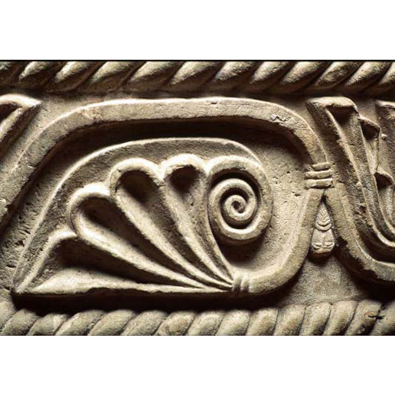 a llitle human head, a bearded male, is semi-hidden in the spandrel