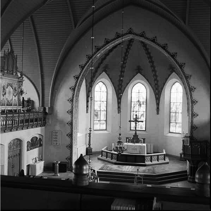 the interior of the modern church; the unimpressive modern wooden font is visible in the northeast corner of the nave