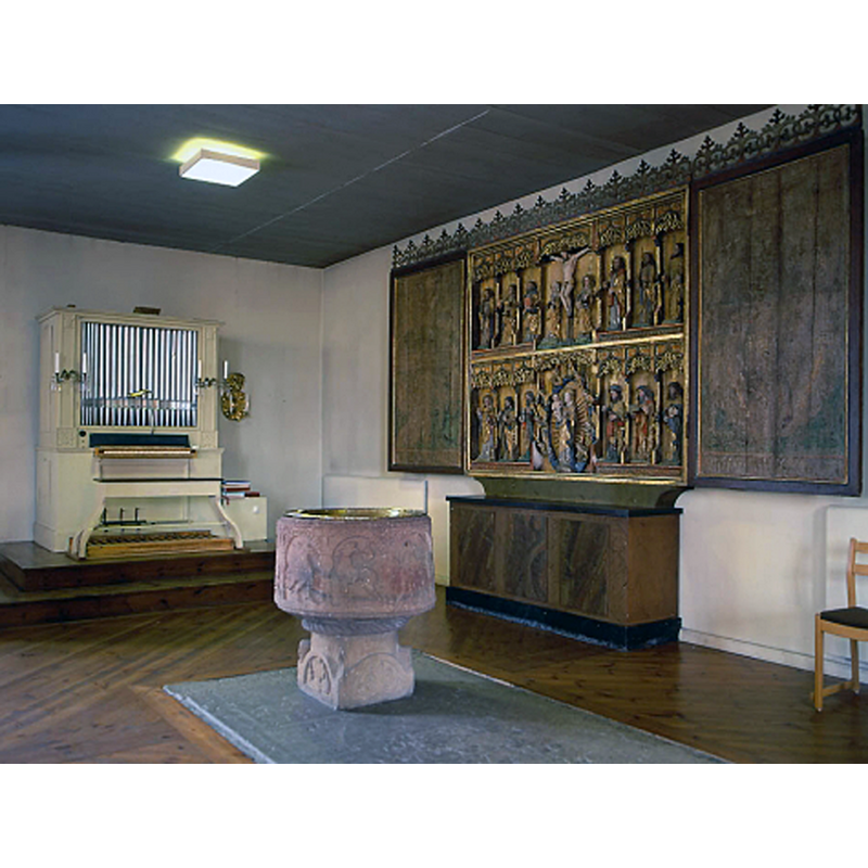 both the font and the old retable were originally from the demolished medieval church; seen here in the mid-18thC church, towards the west end of the nave