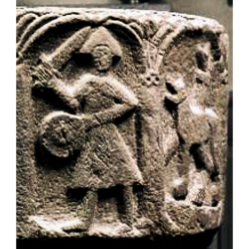 seen here in the right arch; although the quality of the carving is crude, the animal is likely a lion passant to the left, and the bulge on its back a foliated tail end