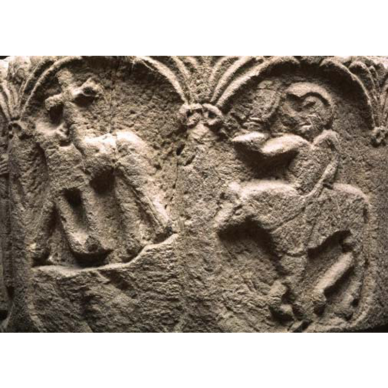 seen here in the left arch; the quadruped may be looking backwards [passant-regardant] but the quality of the carving is very poor