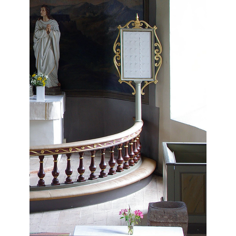 the square font originally from Härlunda kyrka is partially visible here in the foreground
