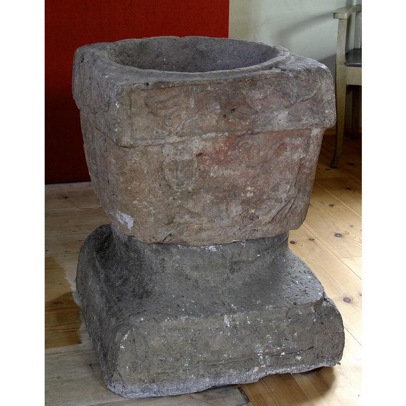 the square font originally from Härlunda kyrka seen here in Bjärklunda kyrka