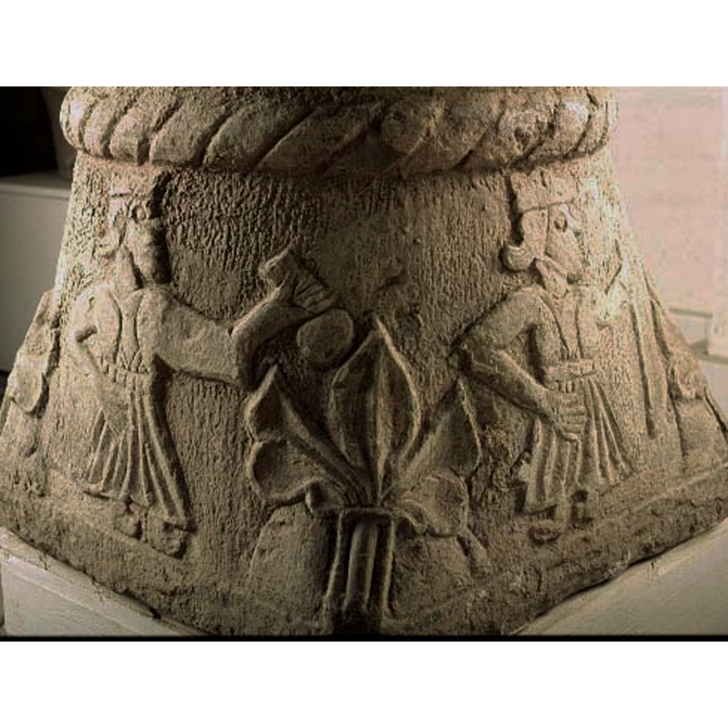 the two figures wear crowns; the one on the left appears to hold a money bag (?)