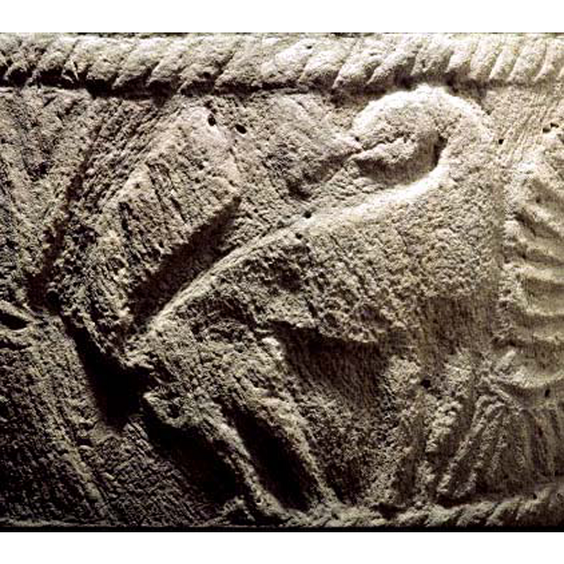 passant to the right -- although it looks like a schematic quadruped the position and shape of the tail, and the 'floriated' tongue suggest a lion