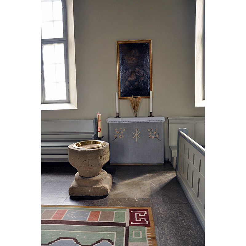 the composite font located at the east end of the nave, south side