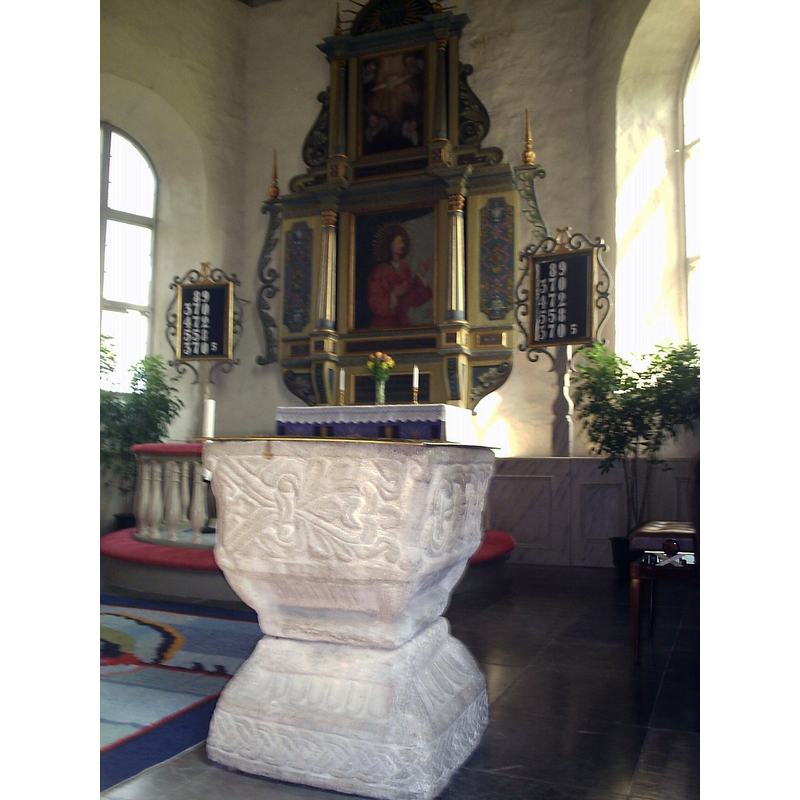 the old font at the southeast end of the nave
