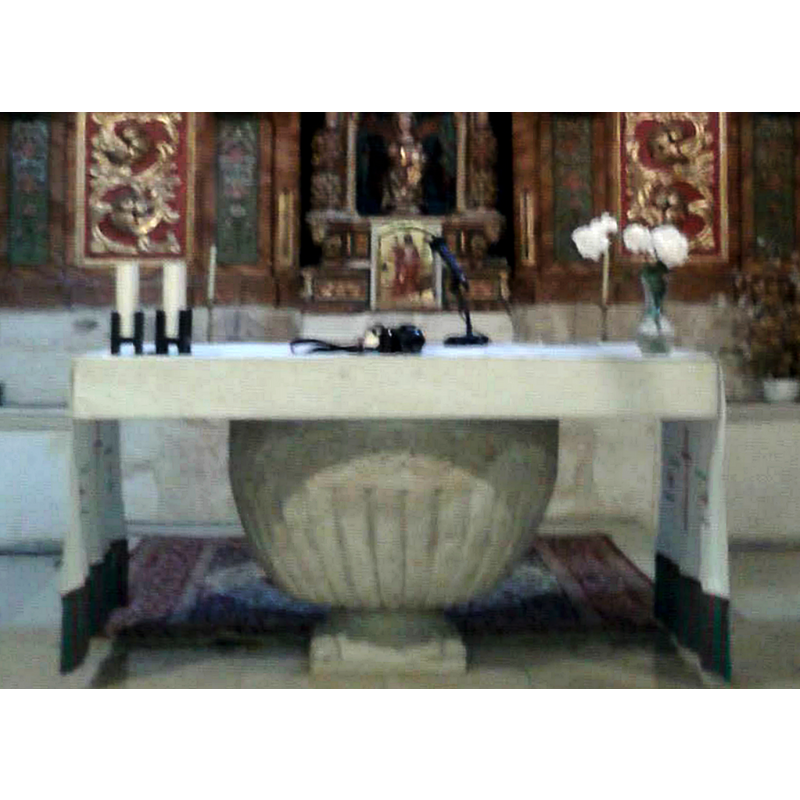 now serving as base of the altar stone top is a medieval baptismal font unearthed in the churchyard