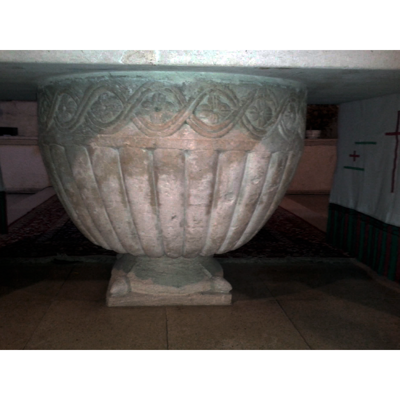 now serving as base of the altar stone top is a medieval baptismal font unearthed in the churchyard