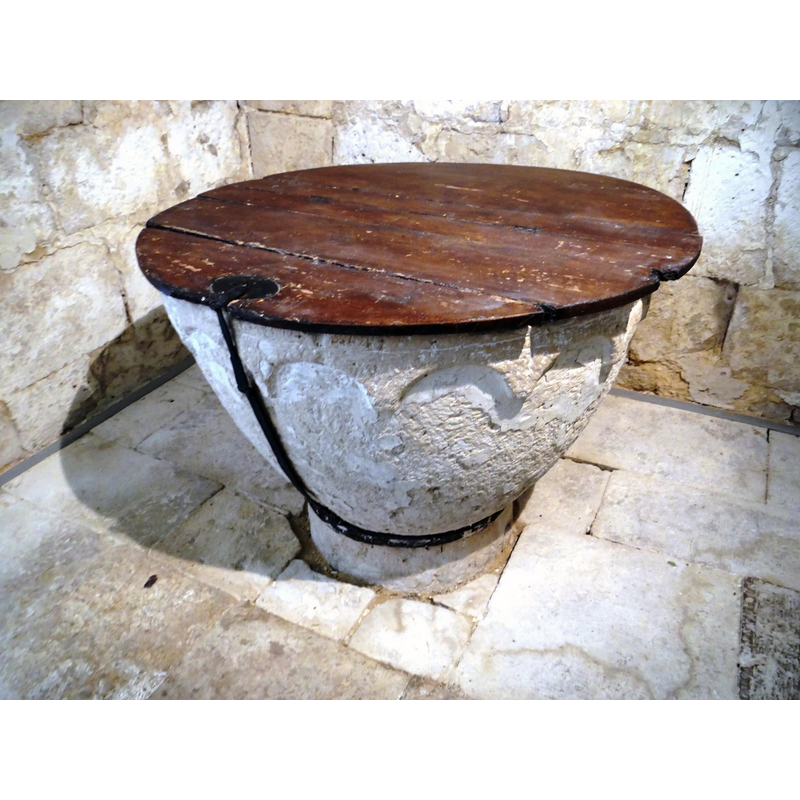 the black metal chain that secures the font cover to the base of the font is visible here