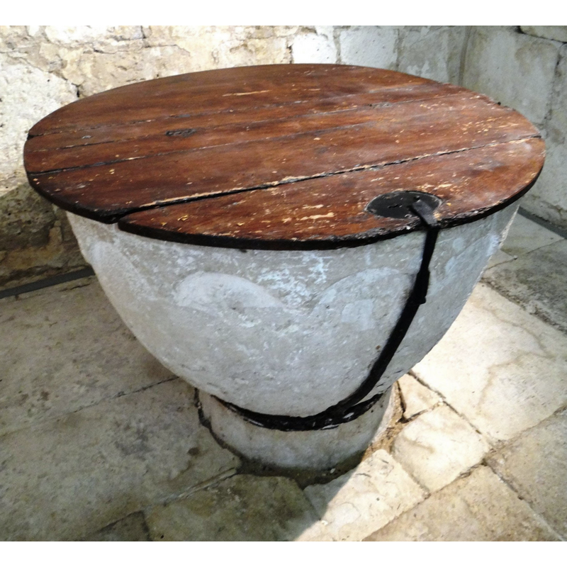 the black metal chain that secures the font cover to the base of the font is visible here