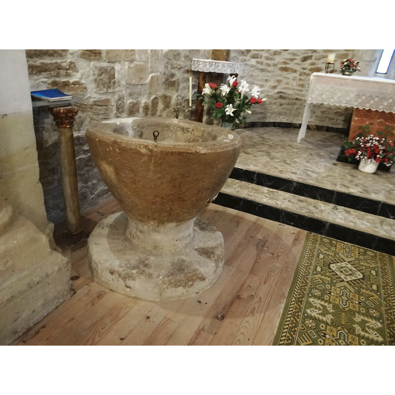 by the left [north] pillar of the chancel arch