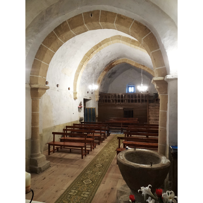 the font is visible in the foreground, by the north pillar of the chancel arch