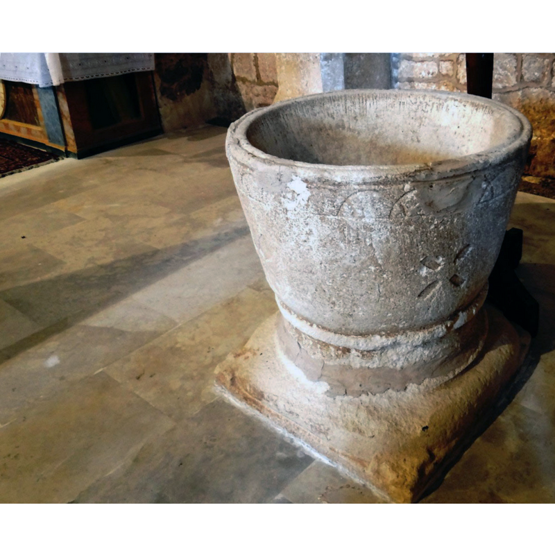 notice the large repair to the upper rim on the right of the image, damage probably caused by an anchoring of the old cover