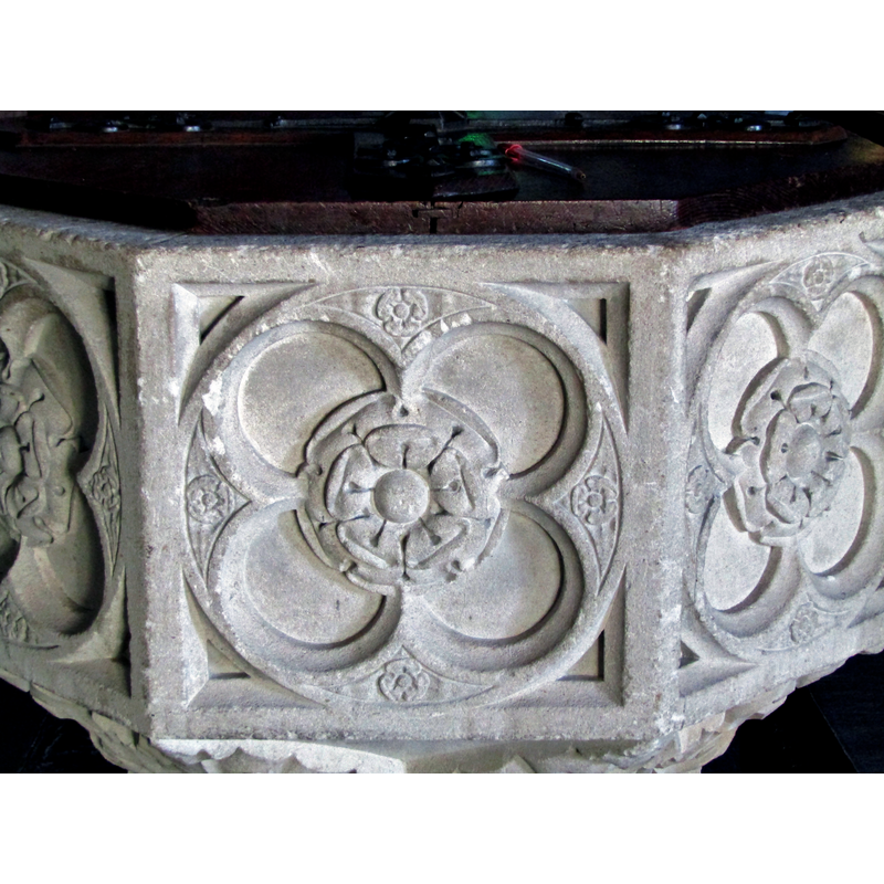 tiny roses, like the larger ones in the centre of the panel, but these are jammed into the spandrels of the quatrefoils