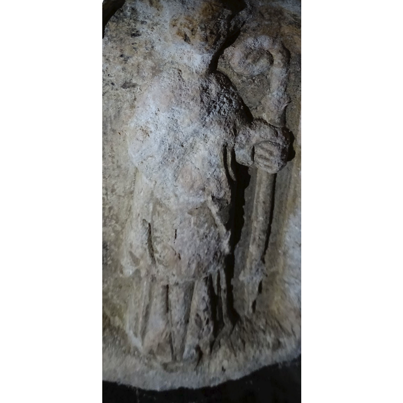 the much damaged figure of a bishop