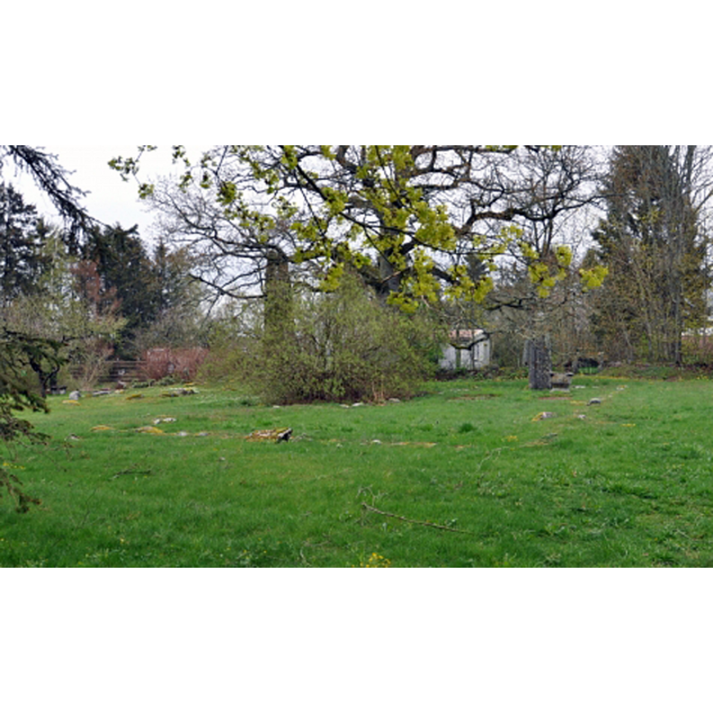 some of the stones of the foundations of the demolished old church are still visible, marking the contour of the exterior