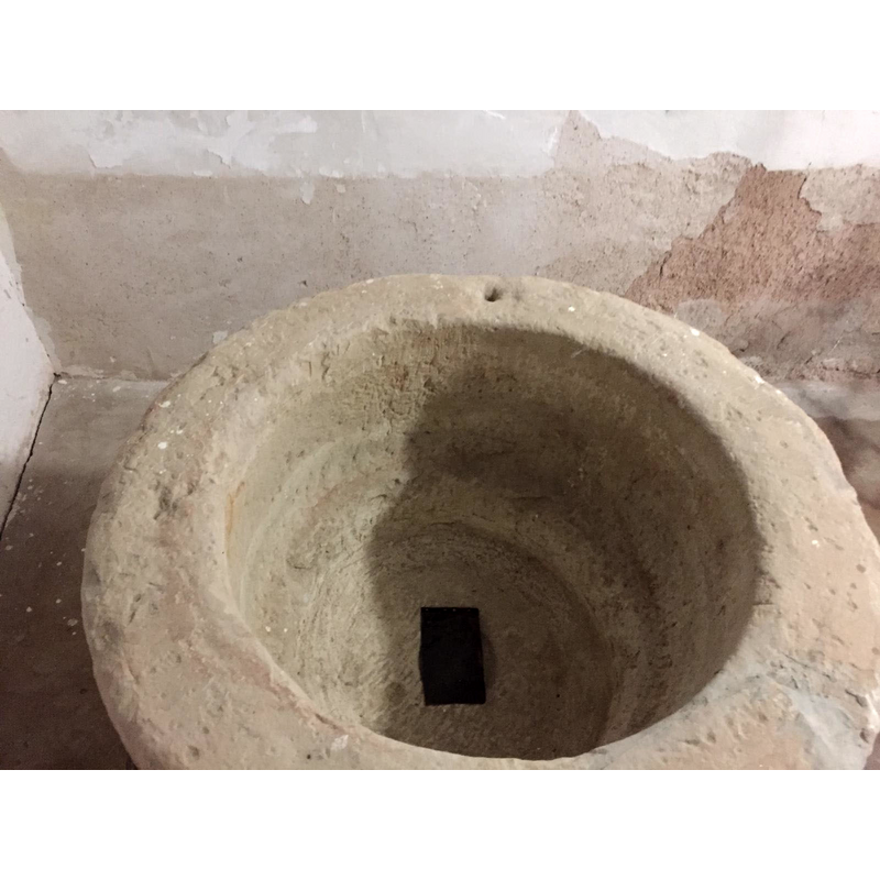 notice the drilled hole and the scar on the upper rim, both probably related to anchoring and/or locking hardware for an earlier font cover