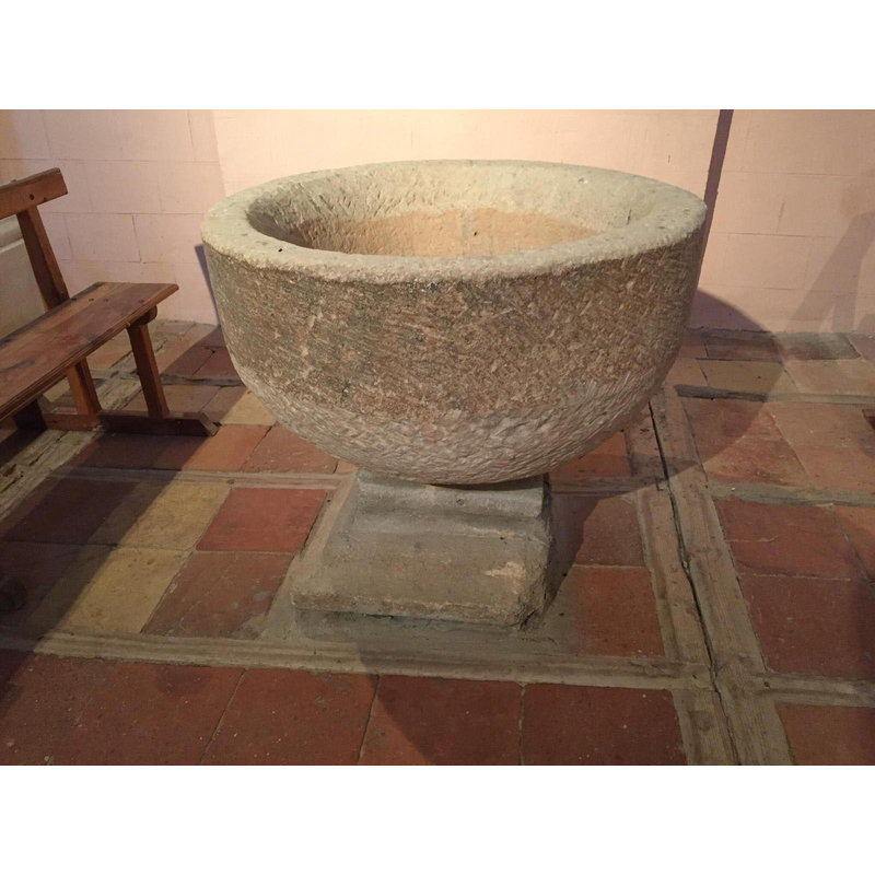 on the upper part of the later base; this base may have been part of something else, and simply used to replace the original base of the font