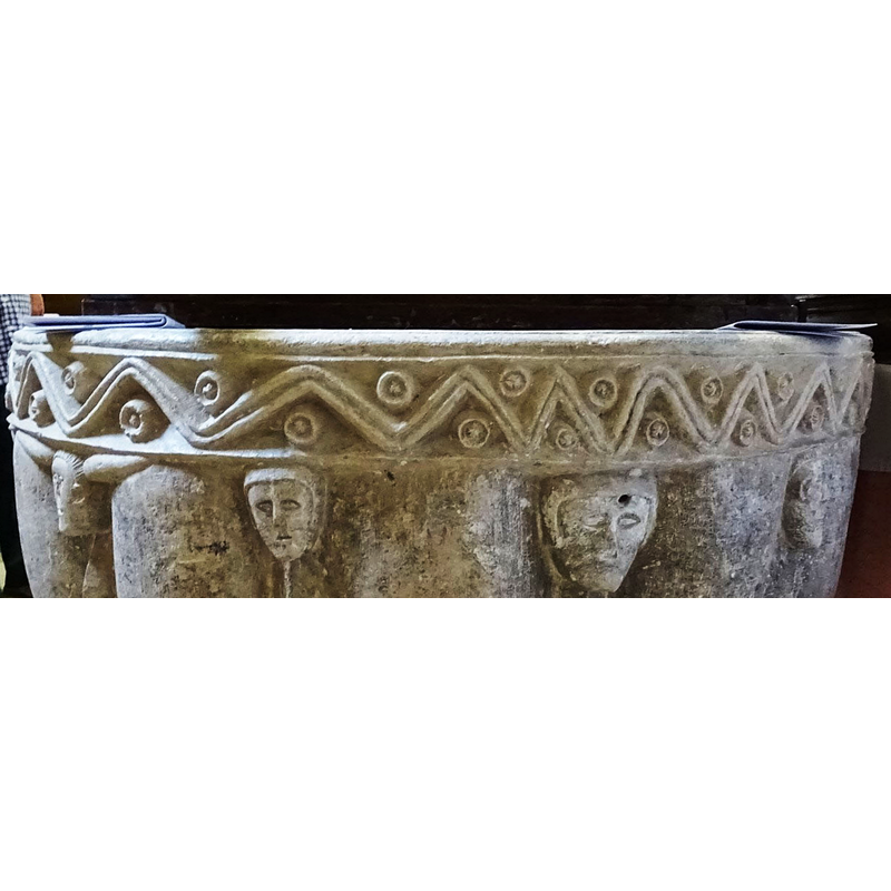 notice the change of spacing the carver made to the pattern; did the carver realise all of a sudden being he was being paid by the number of peaks and valleys? -- notice also the drilled whole in one of the heads here; it have been made to anchor hardware related to a font cover