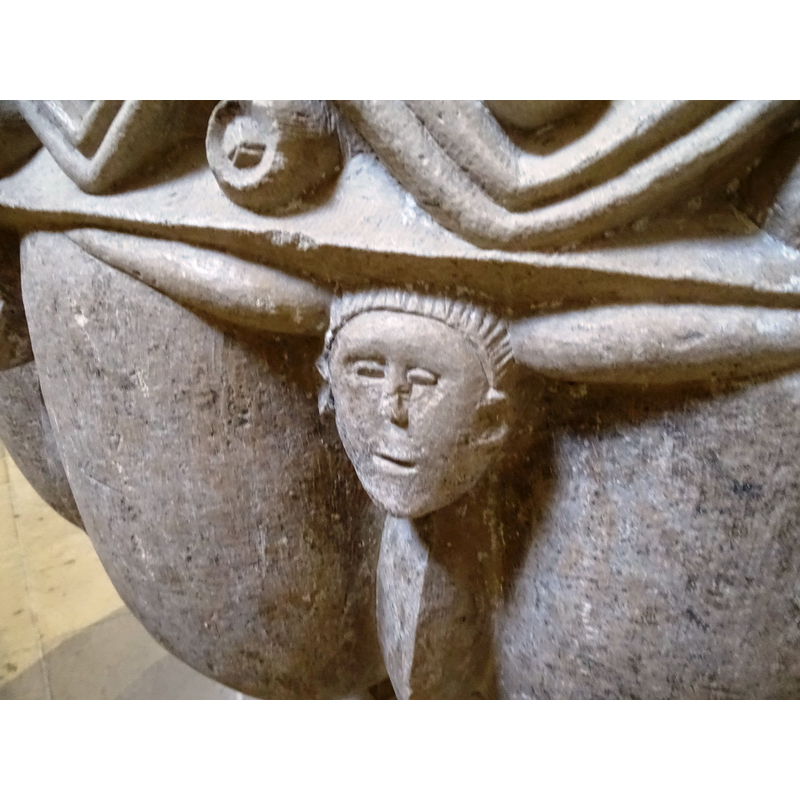 a young man's? what are the horn-like objects that appear to protrude from the sides of his head?