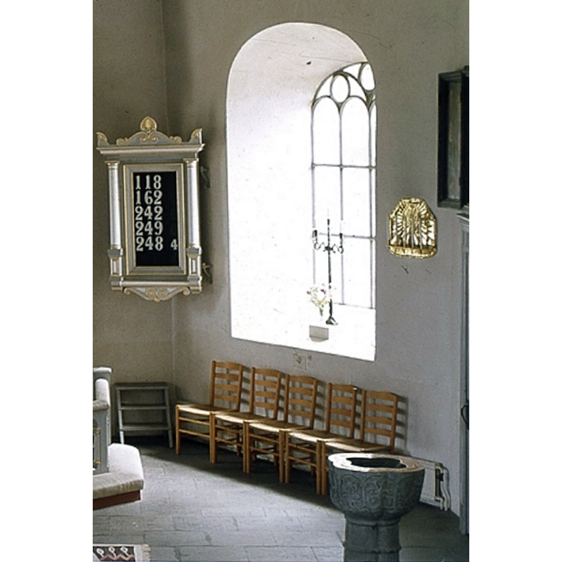 in the southeast corner of the nave, right of the communion railing