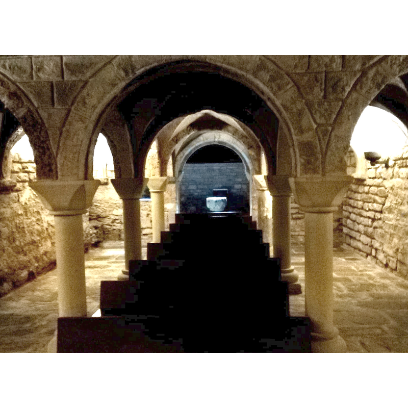the baptismal font is visible at the far [west] end