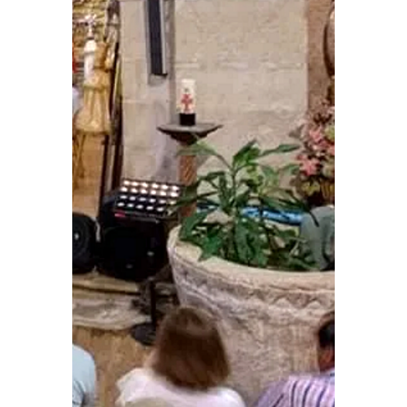 west view of the font; it is located by the right [south] pillar of the chancel arch, with the altar to the left