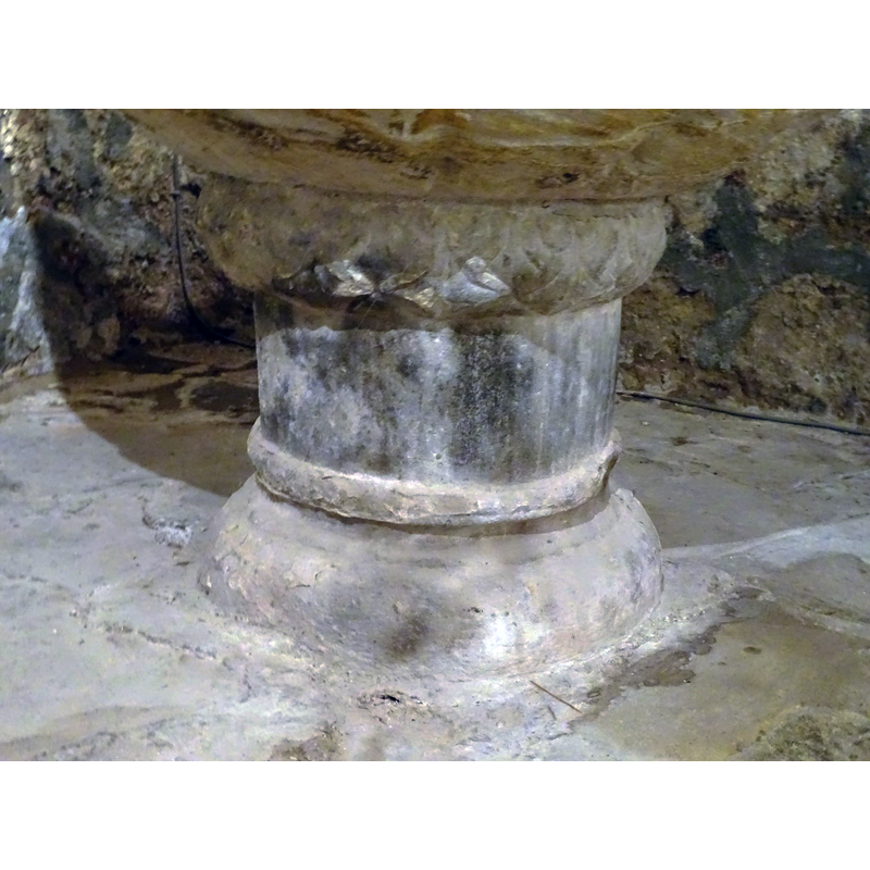 seen here at the top of the stem of the base