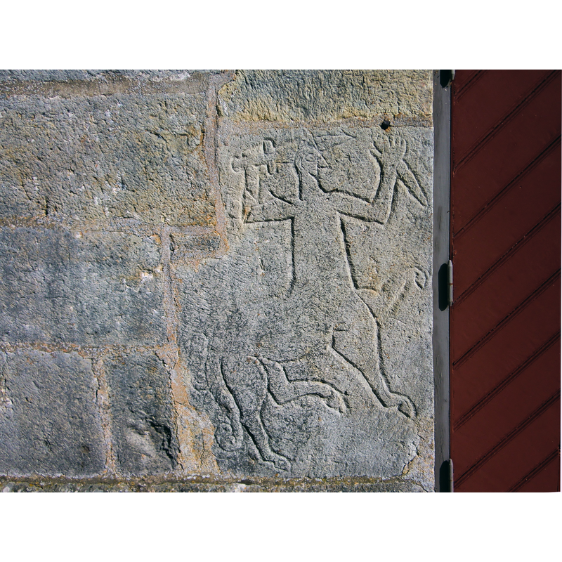 Source caption: "Kentaur relief vid en av ingångarna till Gösslunda kyrka, Kålland. Syftet med den ickekristna reliefen har tolkats som ett försök att skydda kyrkan mot ondska."