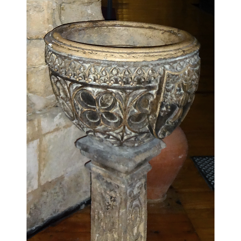 one of several interesting holy-water stoups in this church