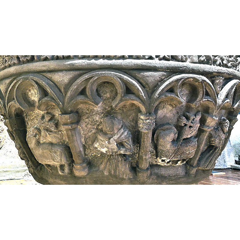 two of them visible here: one in the left arch, another two arches over to the right; they are quite different in the shape and details of the animal body, the form of the cross and that of the banner