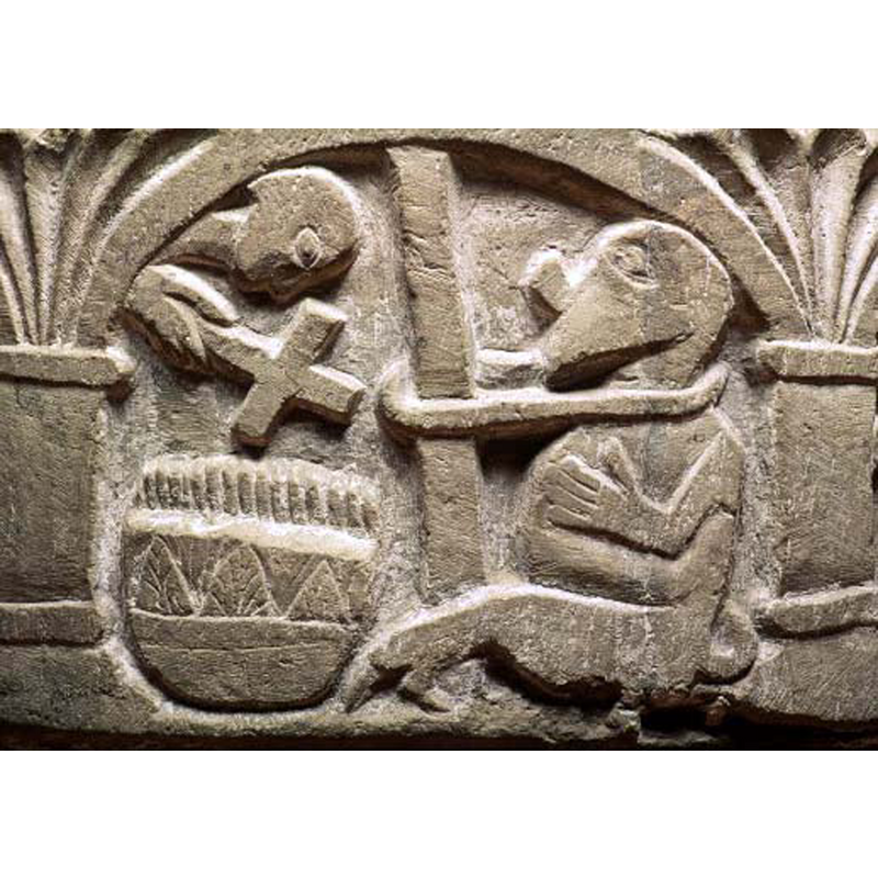 On the right side of the composition is the devil shown tied to a pole. A priest holds a cross over the water of the baptismal font, "Benedictio fontis". The font itself is cauldron-shaped and decorated vessel