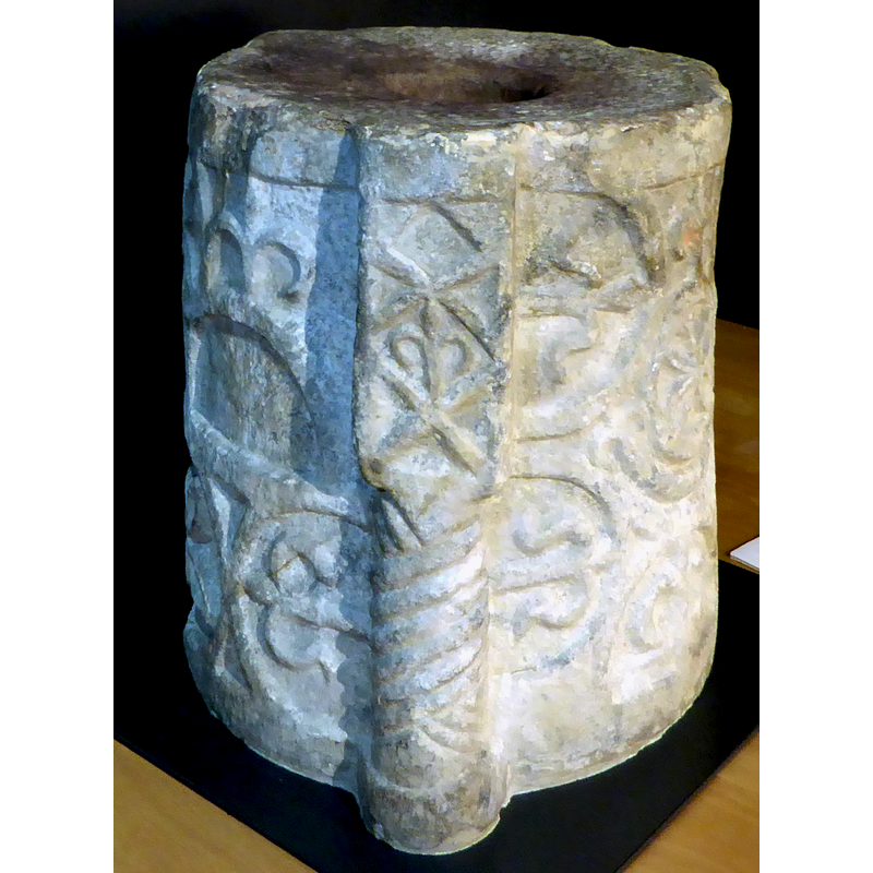 on the vertical side protrusions of the base; also visible here is part of the back decoration