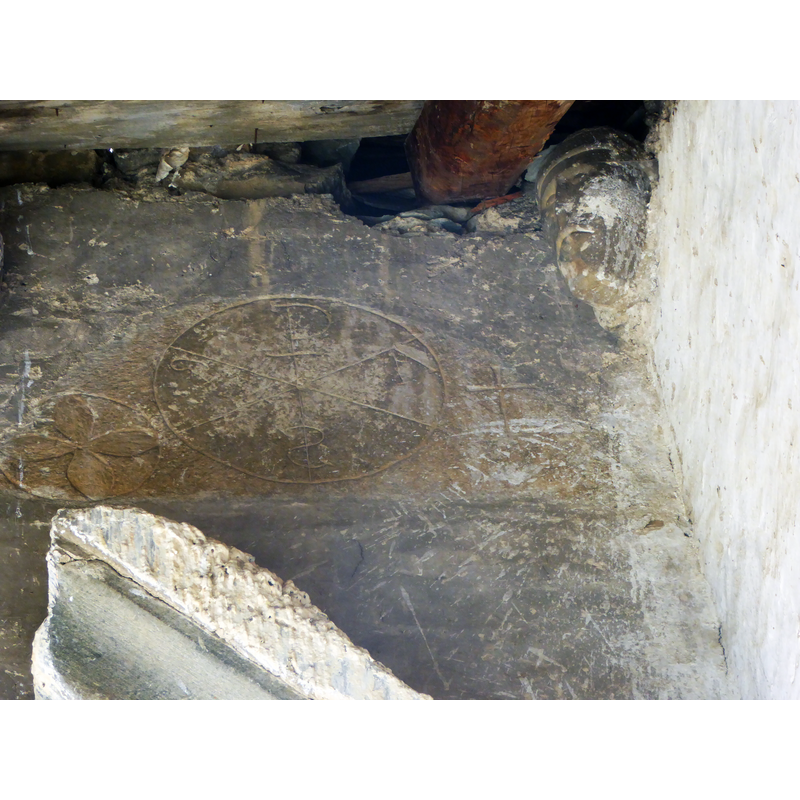 the carved Chi-Rho christogram on the ground is said to have belonged to the medieval church here