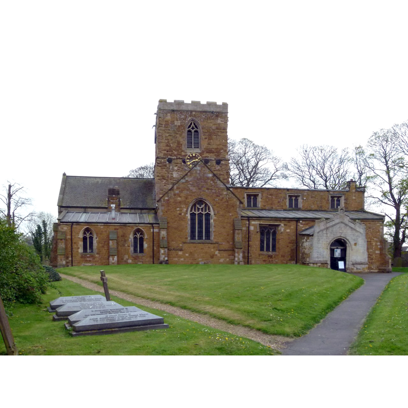 Source caption: "Church of St Remigius, Long Clawson. The church seen from the north. This part of the churchyard has been cleared of headstones which have been placed along the eastern and northern perimeters. The vestry alongside the chancel is a 19th century addition. The north porch has been closed off to provide toilet facilities."