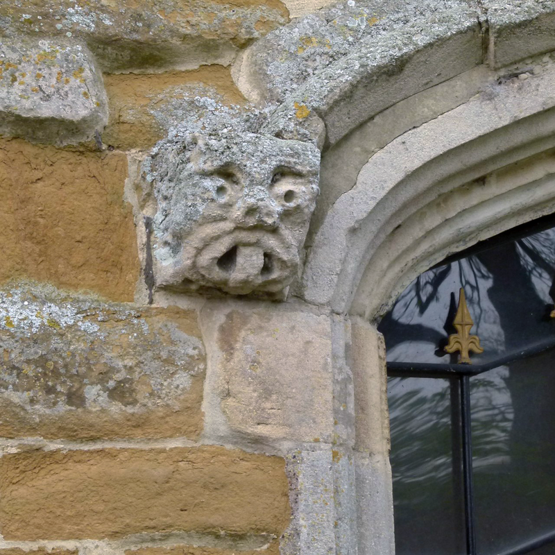 Source caption: "Church of St Remigius, Long Clawson. Mould stop on the south porch doorway. The style is Romanesque, suggesting re-use from an older building."
