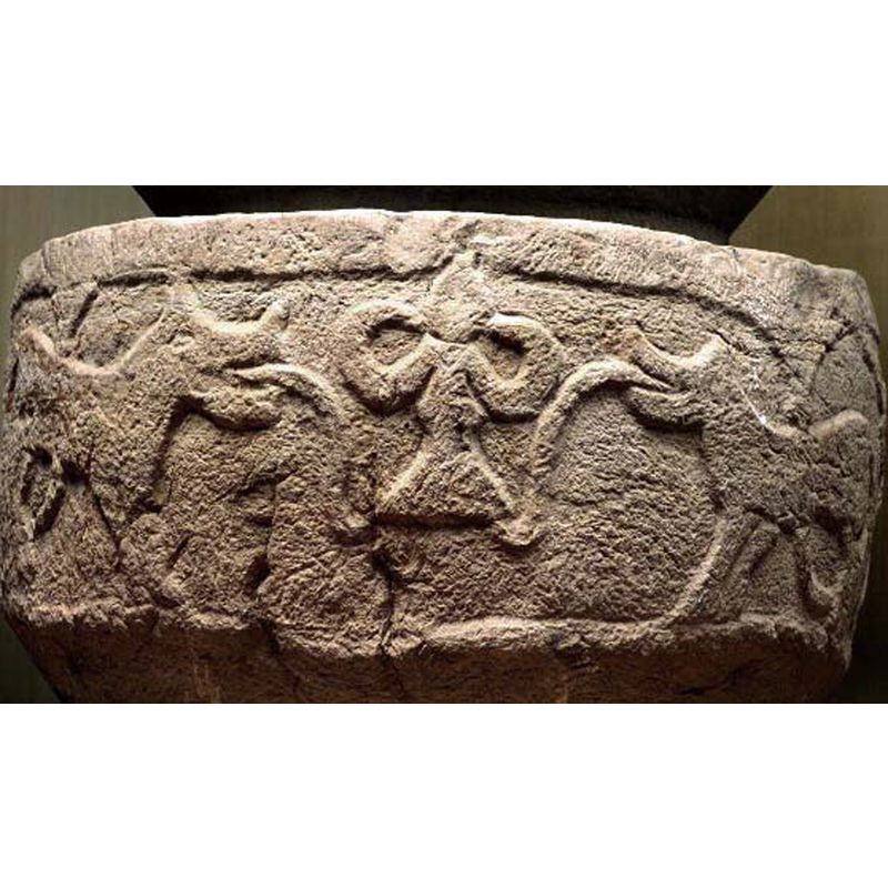 a large lilly-like flower with almost human appearance stands between the two facing lions with extended tongues