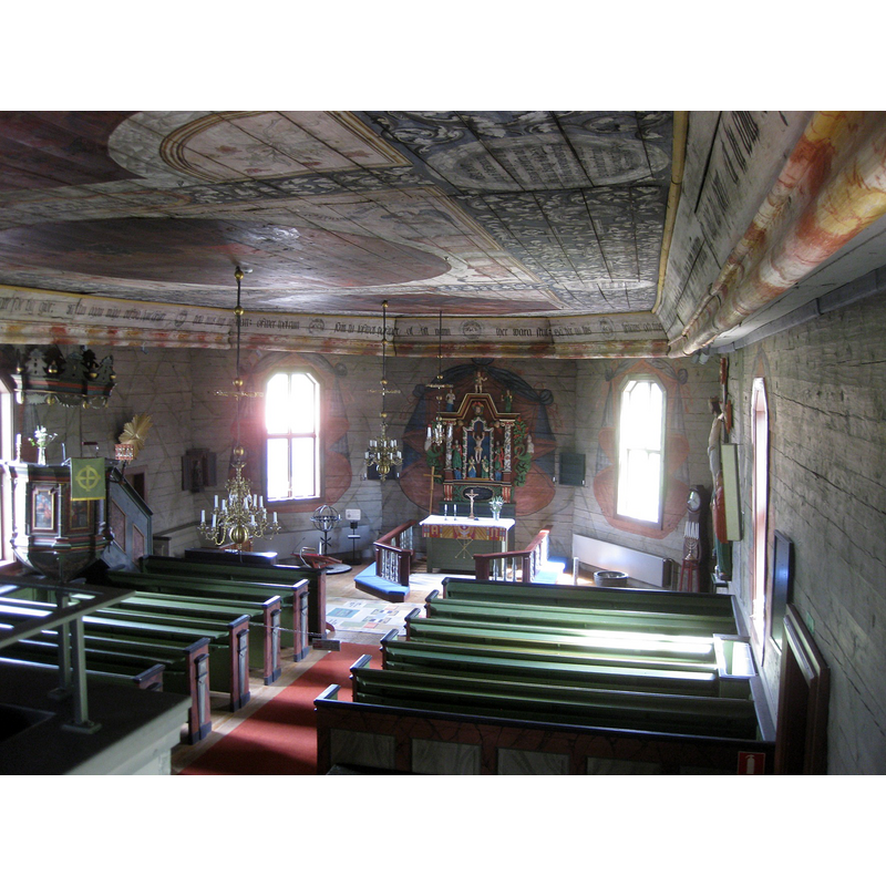Source caption: "Interiör av Älgarås träkyrka i Västergötland. Långhuset är från medeltiden. Takmålningarna med motiv från Bibeln är målade 1750-52 av Mäster Anders Broddesson från Fredsberg." -- the medieval font is partially visible at the far [east] end, right [south] side