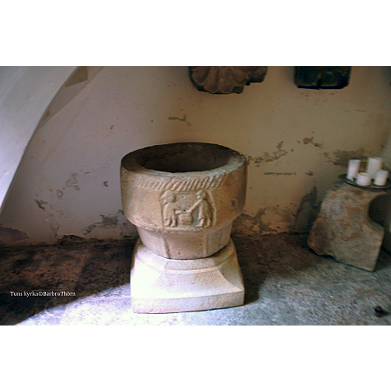 the re-mounted basin of the medieval font seen now [2020] in the context of the porch [vapenhuset], a sort of mini-lapidarium displaying olf stones from the medieval church here